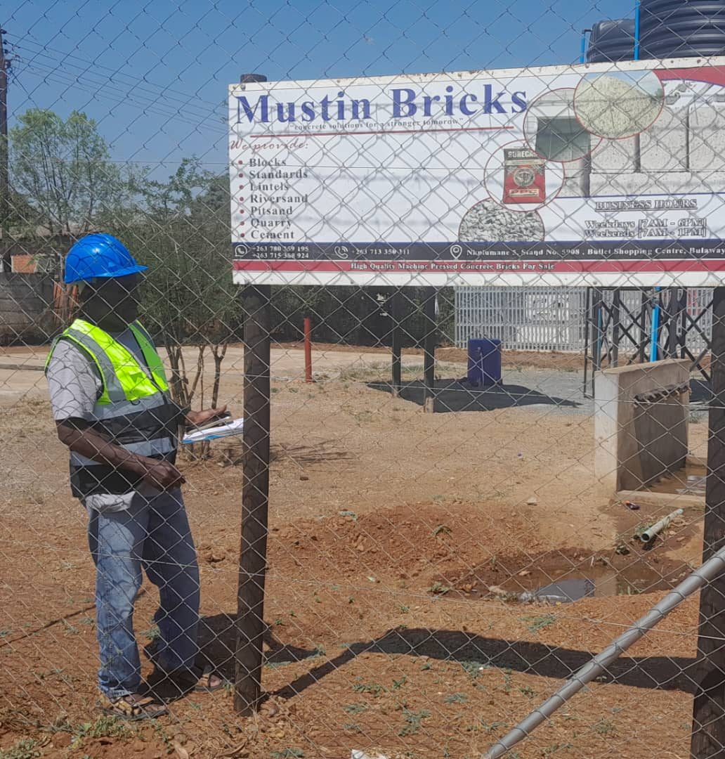 Stock check at the Mustin Bricks sign